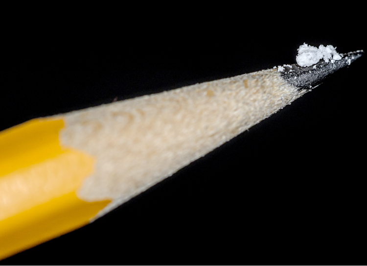 A lethal dose of fentanyl on the tip of a pencil to emphasize the smallness of the amount.